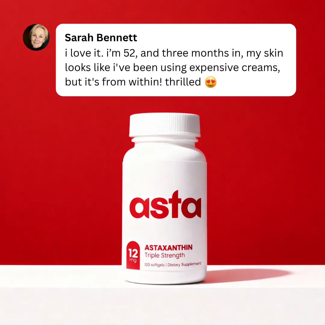 White bottle of 'asta' Astaxanthin supplement with a red background 
